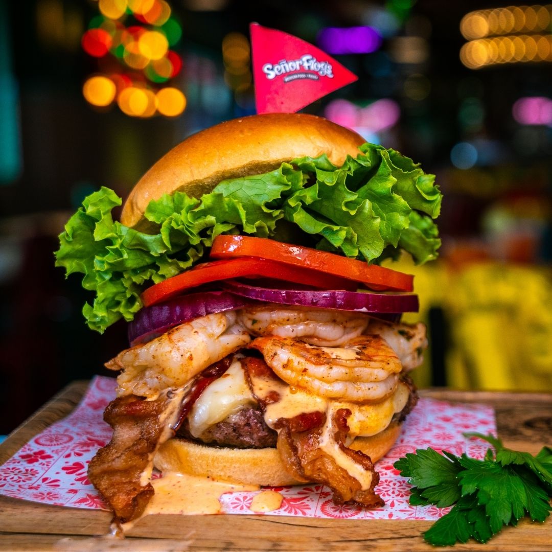 Shrimp and bacon burger with the Señor Frog’s flag at Fort Lauderdale