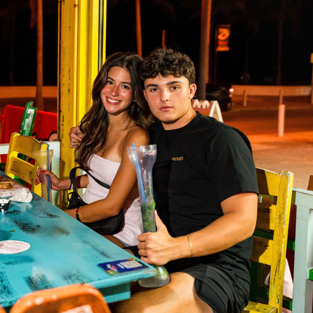 Couple with a yard drink on the terrace at night, Señor Frog’s Fort Lauderdale